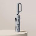 Windproof Folding Umbrella – Reinforced Frame Auto Open/Close Buckle Handle